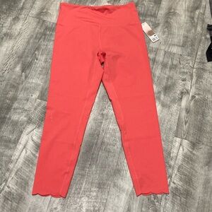 Orange scalloped bottom leggings